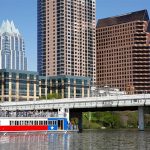a skyline view of Austin, Texas with a boat