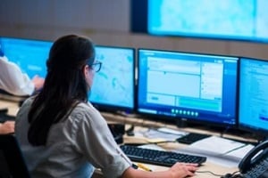 police officer working on computer system