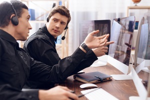 policemen working on computer systems