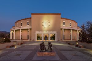 Exterior of the New Mexico State Capitol at night in Santa Fe, New Mexico