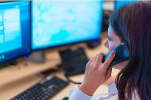 police officer in room on phone